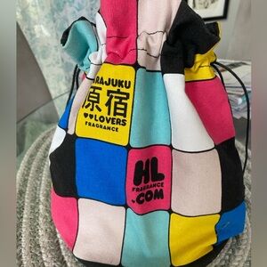 Harajuku lovers pouch bag by Gwen Steffani . Draw string closure, flat bottom .